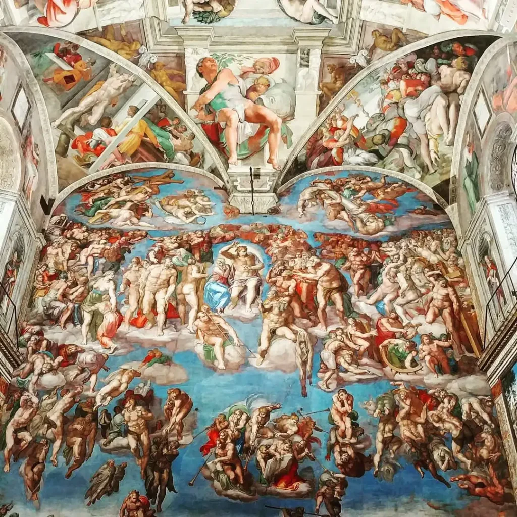 Vatican Museums gallery with classical sculptures and ornate ceiling
